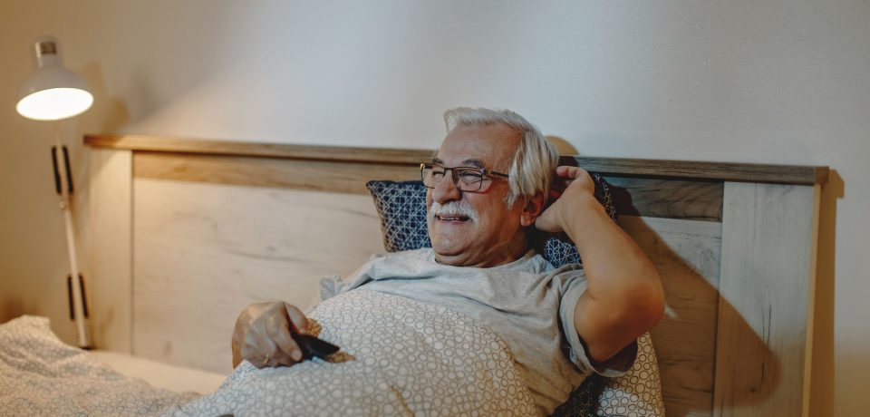 happy-senior-man-watching-tv-while-relaxing-bed-evening (1) (1) happy-senior-man-watching-tv-while-relaxing-bed-evening (1) (1)
