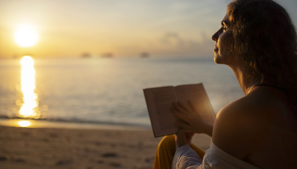 woman-reading-beach-side-view (1) (1)