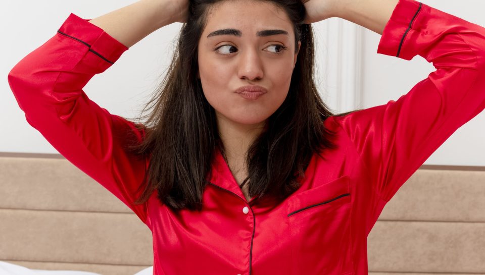 young-beautiful-woman-red-pajamas-relaxing-bed (1) (1)